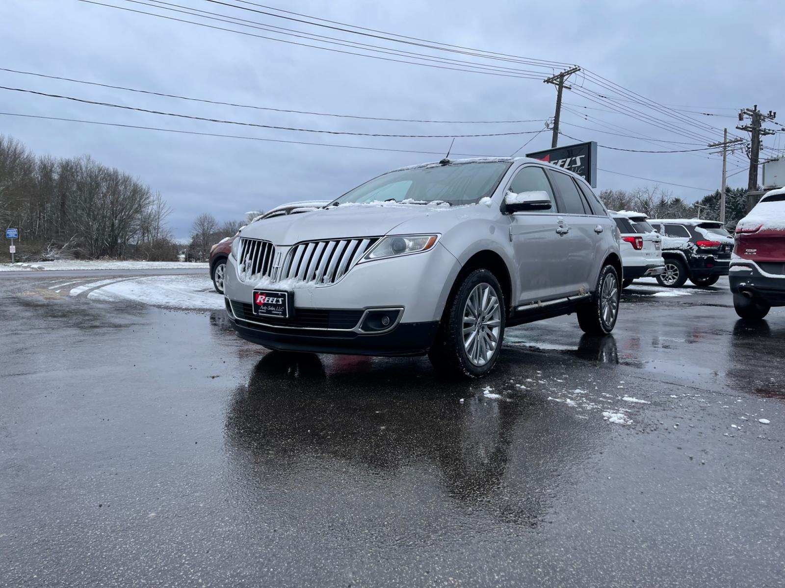 2014 Silver /Black Lincoln MKX Elite AWD (2LMDJ8JK4EB) with an 3.7L V6 DOHC 24V engine, 6-Speed Automatic transmission, located at 547 E. Main St., Orwell, OH, 44076, (440) 437-5893, 41.535435, -80.847855 - This 2014 Lincoln MKX AWD with the Elite Package offers a luxurious and well-appointed driving experience. Under the hood lies a robust 3.7-liter V6 engine mated to a smooth 6-speed transmission, delivering a balance of power and efficiency. Audiophiles will appreciate the premium THX audio system, - Photo #0